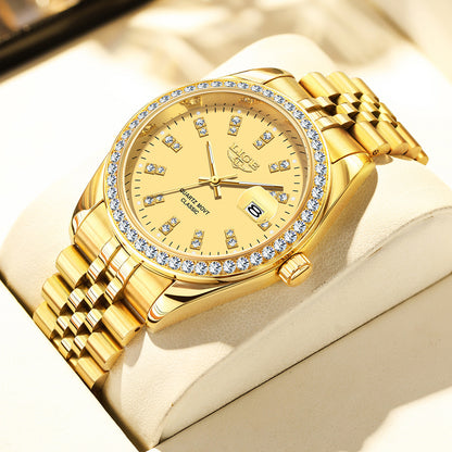 Gold wristwatch with diamond accents on a beige surface