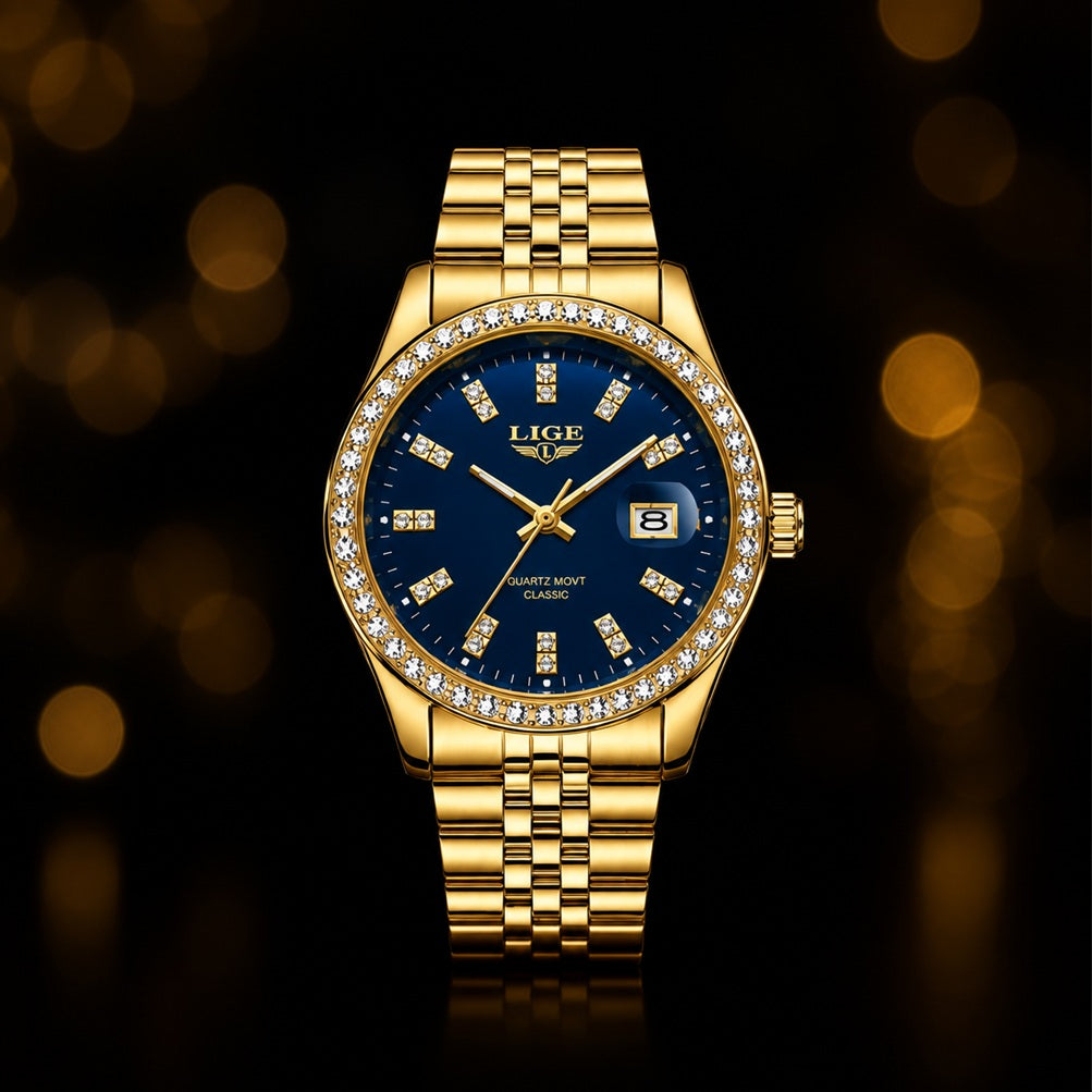 A gold-tone wristwatch with a deep blue dial, a diamond-studded bezel, and a matching gold-tone link bracelet, centered against a dark background with warm golden bokeh lights.