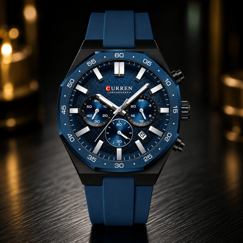 A Curren men's chronograph watch with a blue textured dial, blue silicone strap, and black case, displayed on a dark wooden surface with a blurred background.