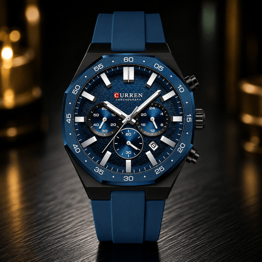 A Curren men's chronograph watch with a blue textured dial, blue silicone strap, and black case, displayed on a dark wooden surface with a blurred background.