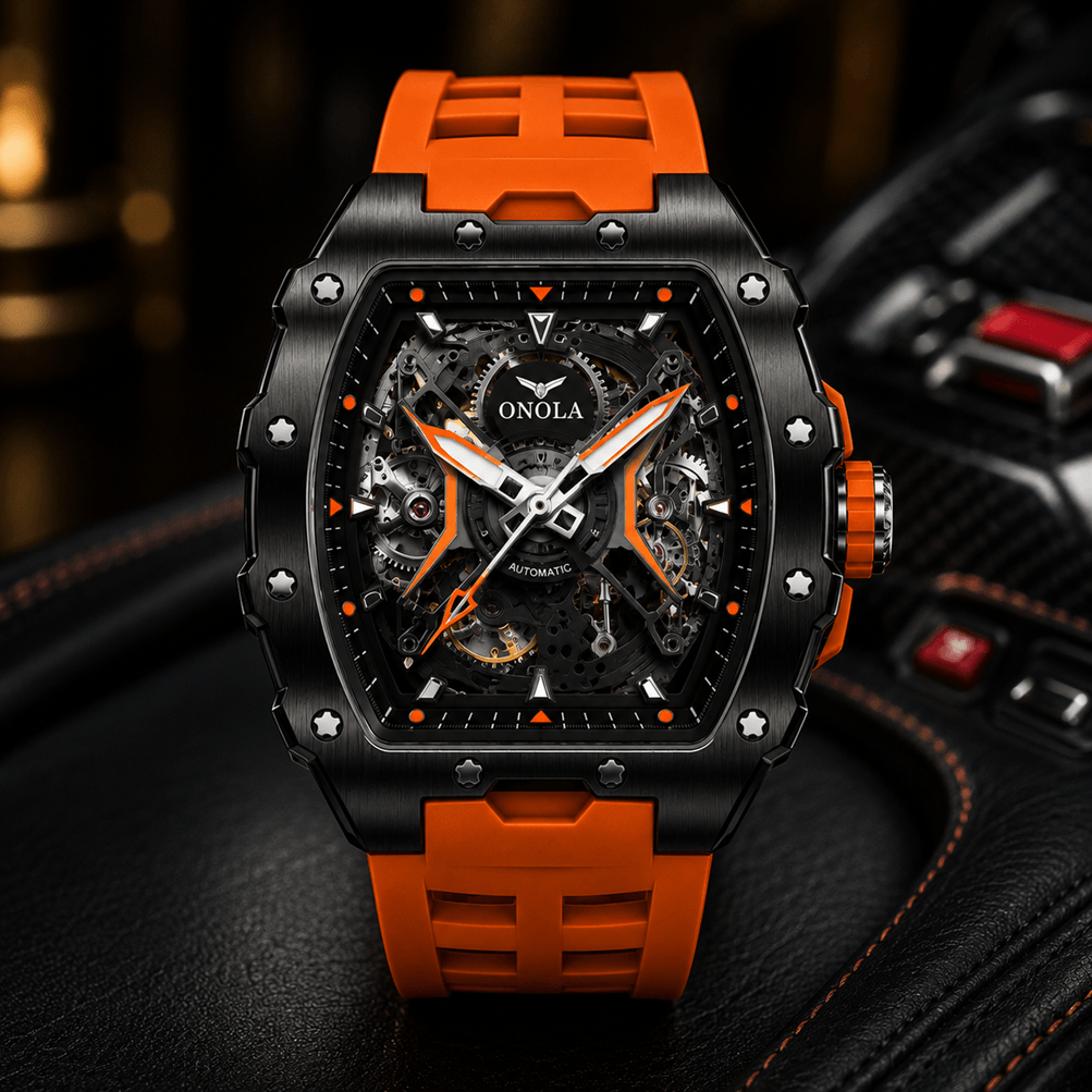 A close-up of an ONOLA skeleton automatic watch with a black case, orange accents, and a matching orange strap, resting on a black leather surface.