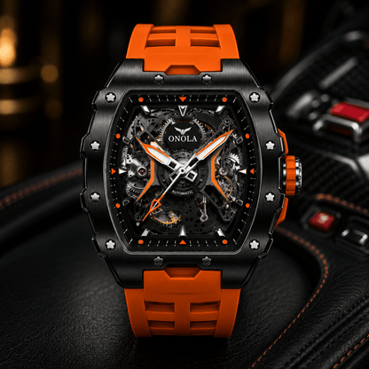 A close-up of an ONOLA skeleton automatic watch with a black case, orange accents, and a matching orange strap, resting on a black leather surface.